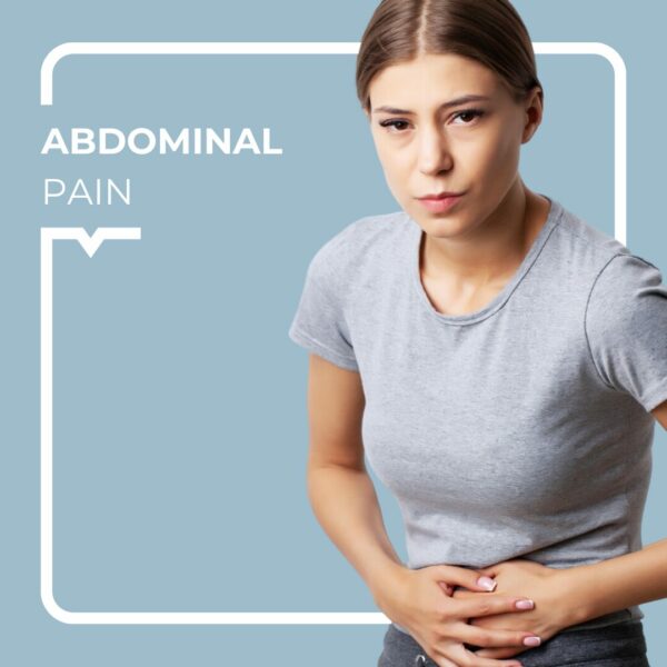 Woman in a grey T-shirt holding her stomach